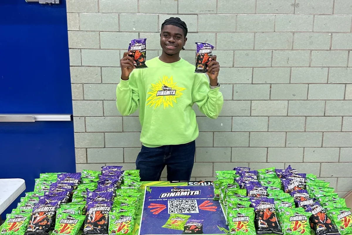 Campus Brand Ambassador running a sampling event with visible product display